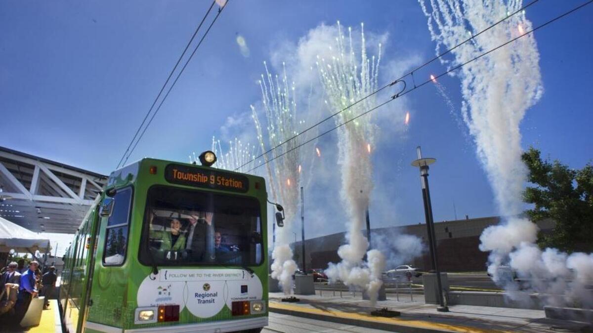 Passengers celebrate the opening of Sacramento Regional Transit’s Green Line in June 2012. The agency is studying whether a bus rapid transit line could extend from the Green Line corridor to Sacramento International Airport while preserving light rail as the long-term goal. Passengers celebrate the opening of Sacramento Regional Transit’s Green Line in June 2012. The agency is studying whether a bus rapid transit line could extend from the Green Line corridor to Sacramento International Airport while preserving light rail as the long-term goal.